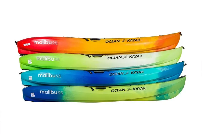 Slide: The Image of Colorful 2023 Ocean Kayak Malibu 9.5 models stacked, showcasing vibrant designs. - 21