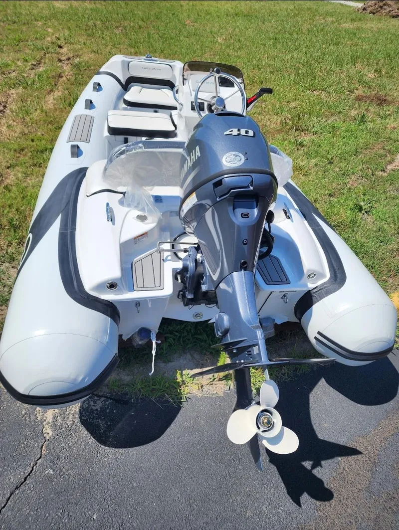 Slide: The Image of 2025 Walker Bay Generation 12 LTE inflatable boat with Yamaha 40 HP outboard motor. - 2