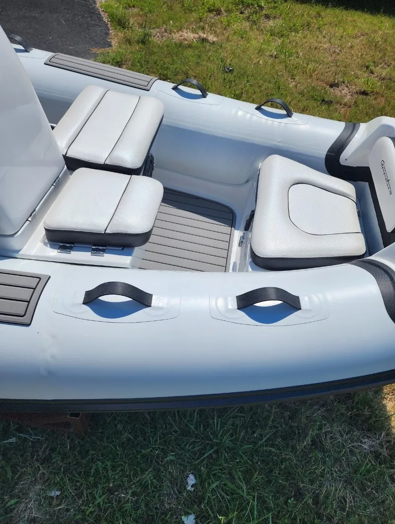 Slide: The Image of 2025 Walker Bay Generation 12 LTE inflatable boat with cushioned seating. - 3