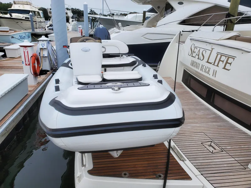 Slide: The Image of 2025 Walker Bay Generation 12 LTE boat docked at marina. - 8