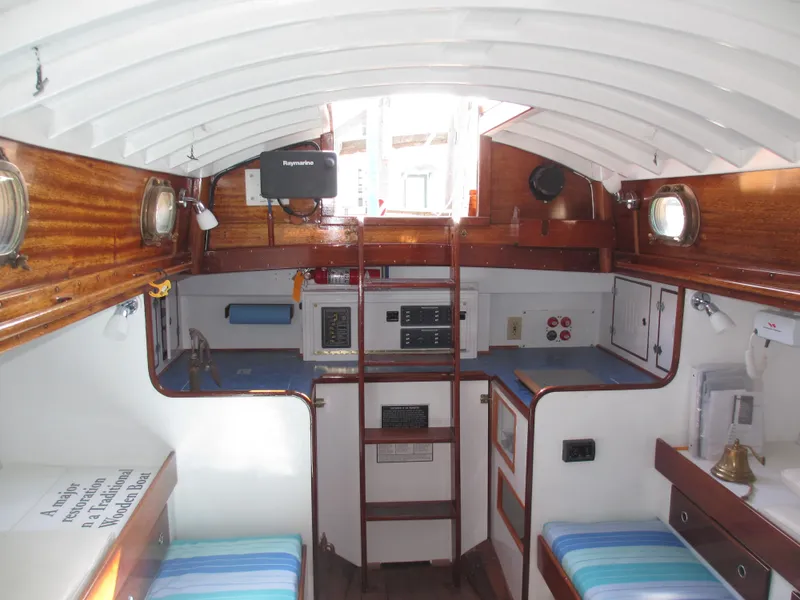 Slide: The Image of Interior of 1957 Sparkman & Stephens K35 sailboat with wooden accents and nautical decor. - 15