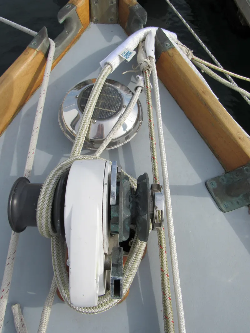 Slide: The Image of 1957 Sparkman & Stephens K35 sailboat deck with winch and ropes. - 7