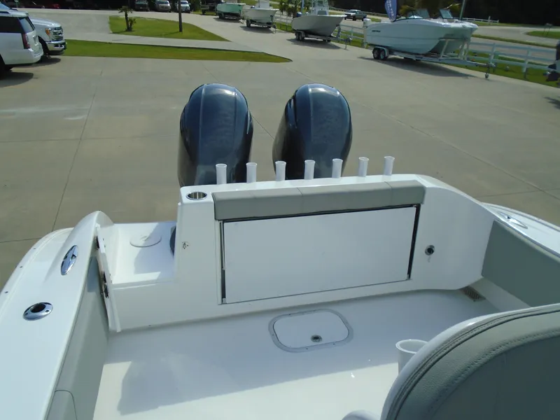 Slide: The Image of 2024 Cape Horn 27XS boat with dual outboard motors and rod holders. - 4