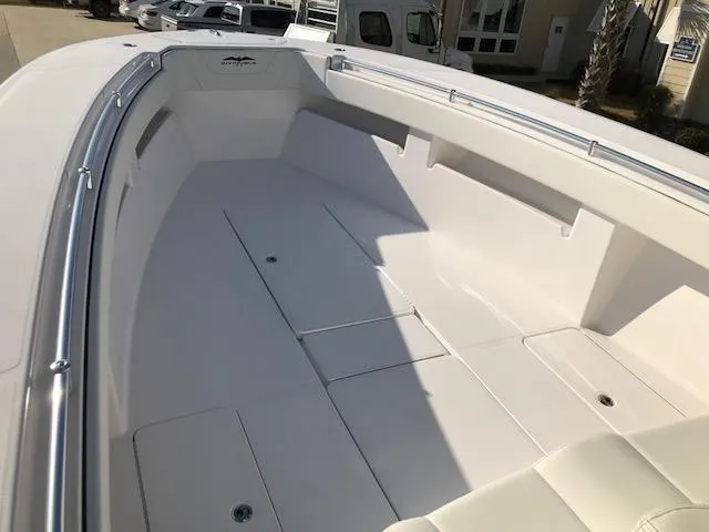 Slide: The Image of 2024 Invincible 36 boat interior, spacious deck with storage compartments. - 13
