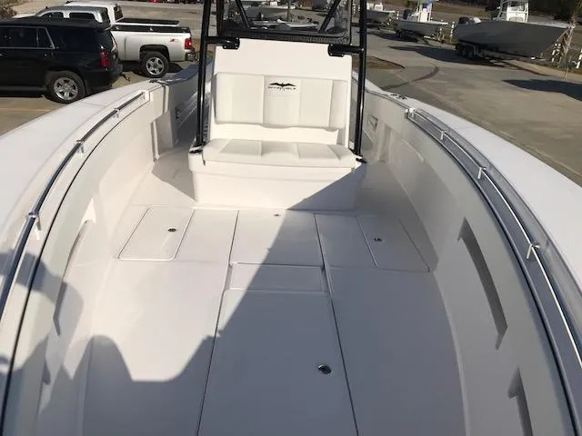 Slide: The Image of 2024 Invincible 36 boat interior, spacious deck with seating and storage compartments. - 15