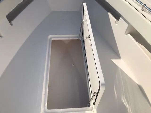 Slide: The Image of 2024 Invincible 36 boat storage compartment with open hatch. - 17