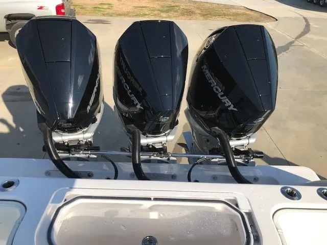 Slide: The Image of Triple Mercury outboard engines on a 2024 Invincible 36 boat. - 4