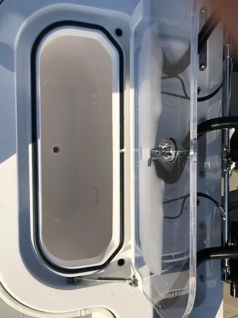 Slide: The Image of 2024 Invincible 36 boat livewell with clear lid and plumbing. - 5