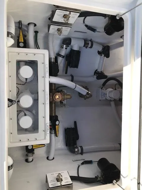 Slide: The Image of 2024 Invincible 36 boat plumbing and electrical system components. - 8