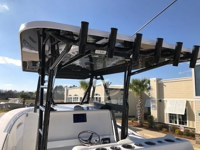 Slide: The Image of 2024 Invincible 36 boat with T-top and rod holders. - 9