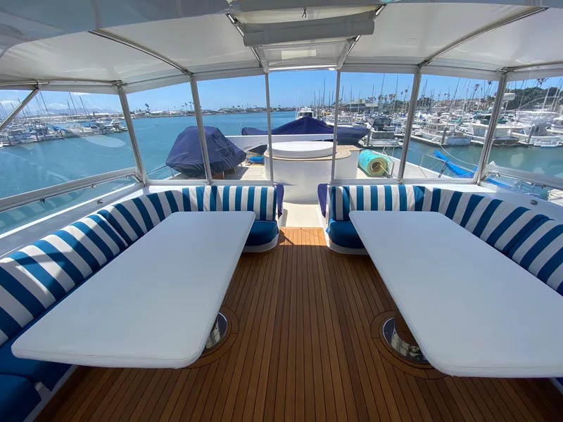 Slide: The Image of Looking aft with two large teak tables - 97