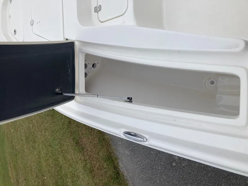 Slide: The Image of 2024 Key West 210 Bay Reef boat storage compartment open. - 16