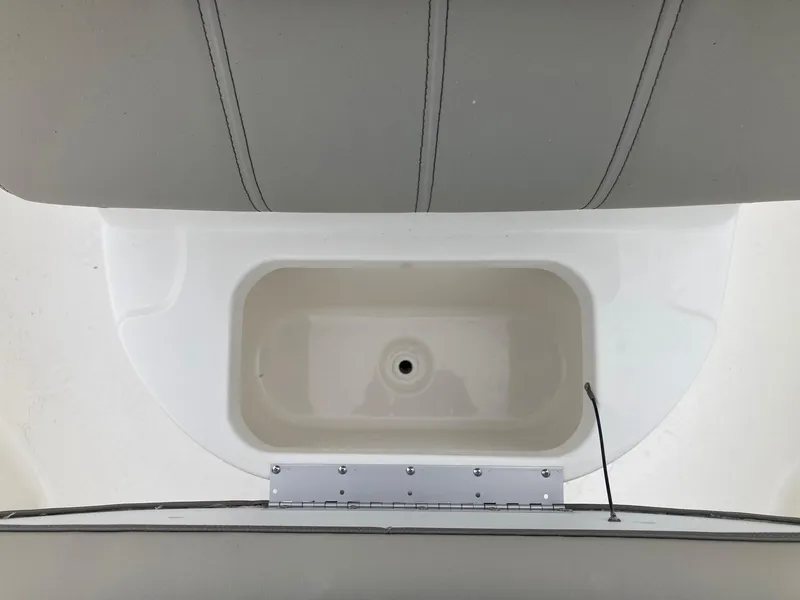 Slide: The Image of 2024 Key West 210 Bay Reef boat livewell and seating area. - 9