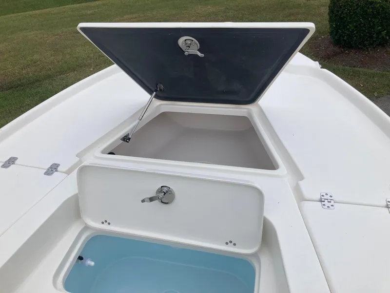 Slide: The Image of 2024 Key West 210 Bay Reef boat storage compartments and livewell. - 11