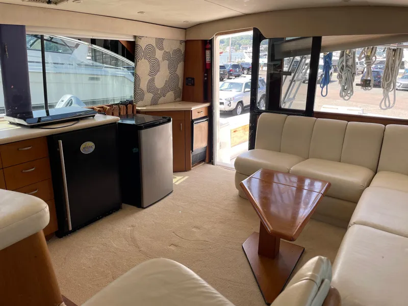 Slide: The Image of Interior of 1998 Ocean Yachts 40 Sport Fish with modern seating and kitchenette. - 12