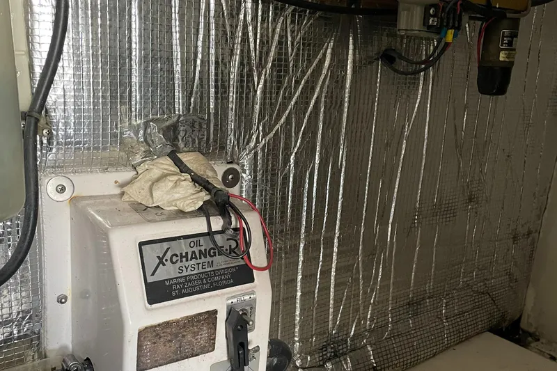 Slide: The Image of Engine room of 1998 Ocean Yachts 40 Sport Fish with oil exchange system. - 23