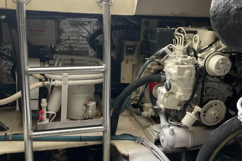 Slide: The Image of Engine room of a 1998 Ocean Yachts 40 Sport Fish, showcasing mechanical components. - 24
