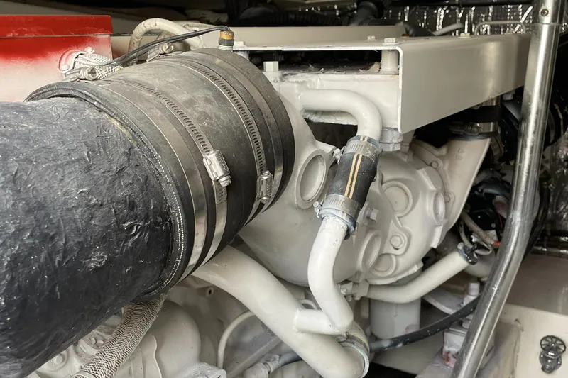 Slide: The Image of Engine compartment of a 1998 Ocean Yachts 40 Sport Fish, showcasing mechanical components. - 26