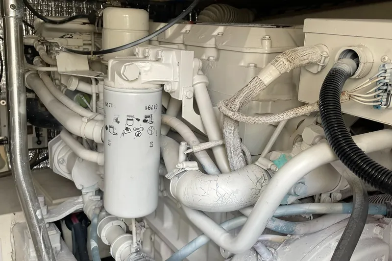 Slide: The Image of Engine compartment of a 1998 Ocean Yachts 40 Sport Fish, showcasing detailed mechanical components. - 20