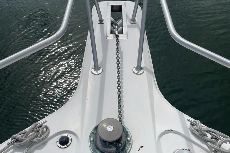Slide: The Image of Bow of 1998 Ocean Yachts 40 Sport Fish with anchor chain and ropes. - 5