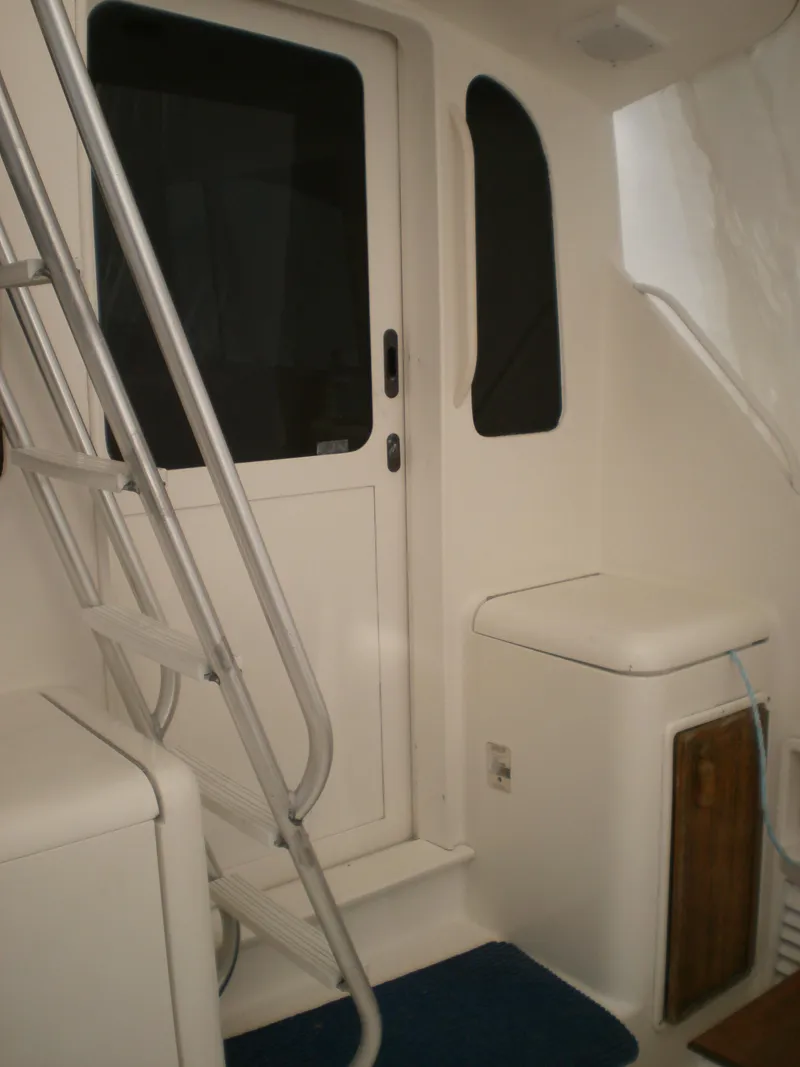 Slide: The Image of 1998 Ocean Yachts 40 Sport Fish interior with ladder and door. - 6