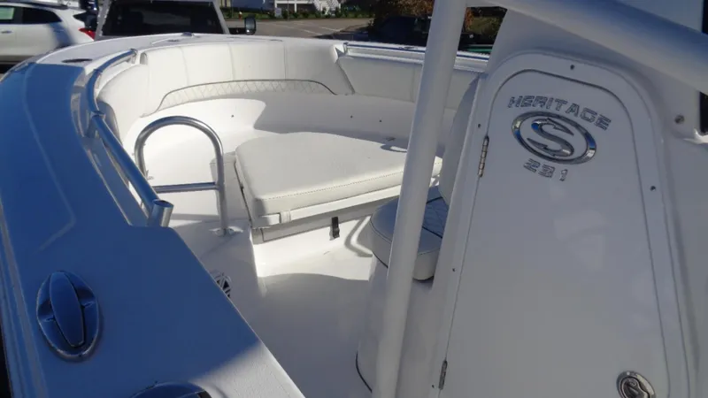 Slide: The Image of 2020 Sportsman 231 Heritage boat interior with white seating and sleek design. - 8