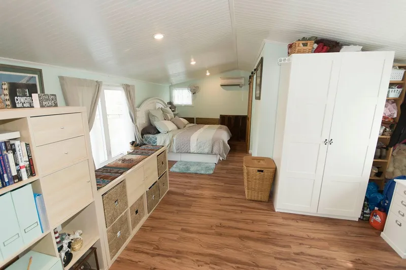 Slide: The Image of Interior of 2017 Chesapeake 48 Houseboat with cozy bedroom and wooden flooring. - 15