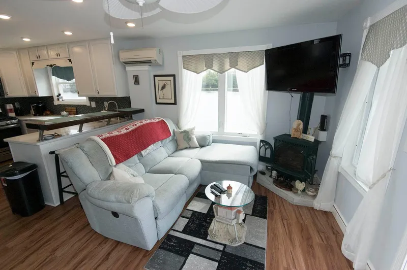 Slide: The Image of Modern interior of 2017 Chesapeake 48 Houseboat with cozy living area and kitchen. - 4