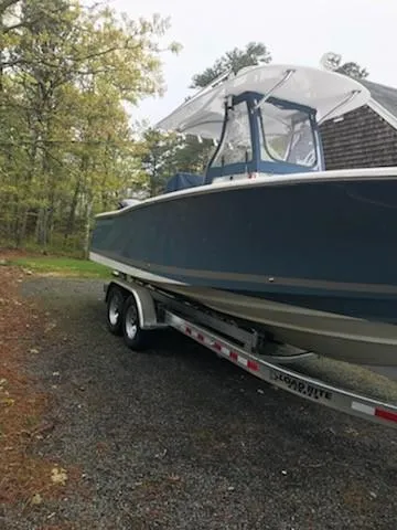 Slide: The Image of 2013 Southport 27 Center Console boat on trailer in wooded area. - 6
