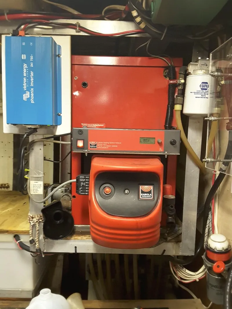 Slide: The Image of Engine room of 1971 Southern Marine MALAHIDE Pilothouse LRC with red machinery and wiring. - 12