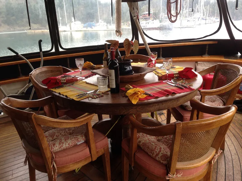 Slide: The Image of Dining area on 1971 Southern Marine MALAHIDE Pilothouse LRC, elegantly set with wine and tableware. - 19