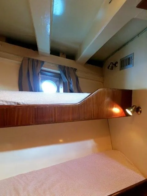 Slide: The Image of 1971 Southern Marine MALAHIDE Pilothouse LRC cabin with bunk beds and porthole window. - 24