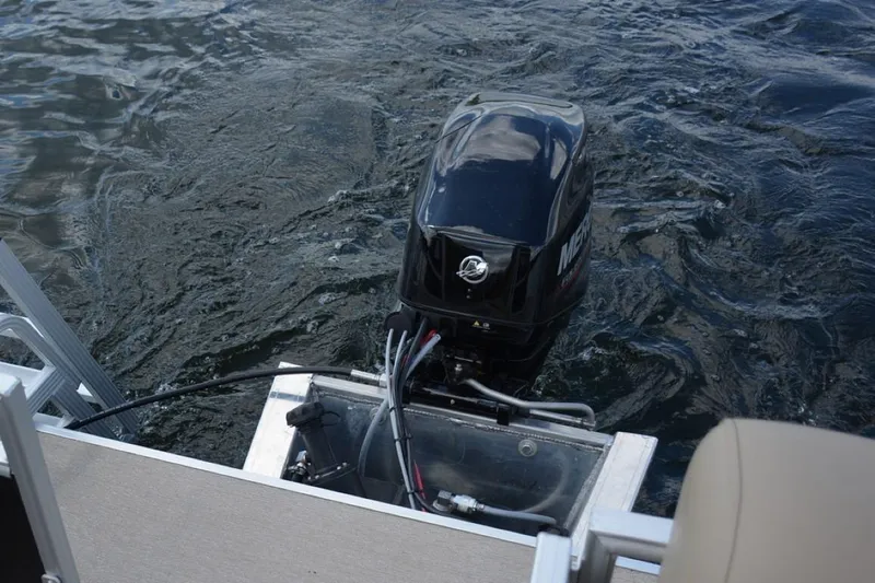 Slide: The Image of 2024 Starcraft LX 16 boat with Mercury outboard motor on water. - 8