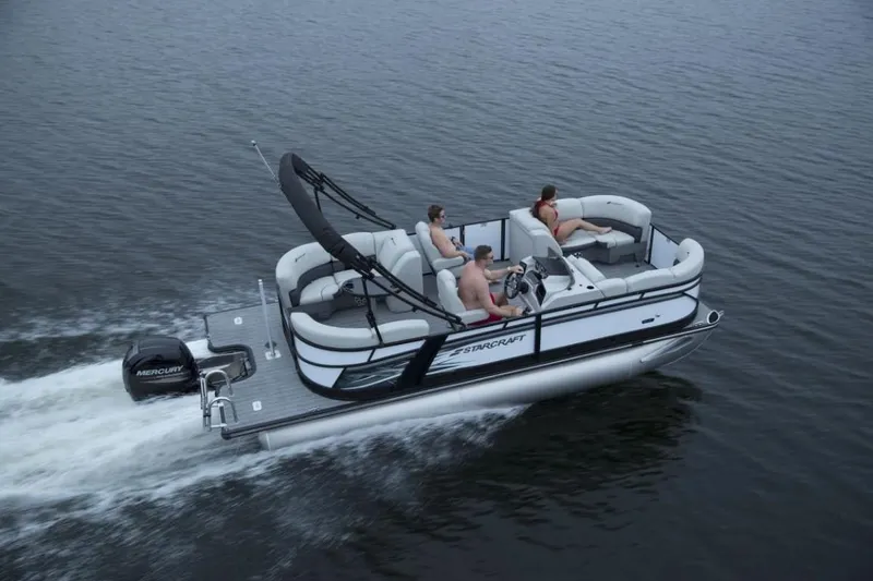 Slide: The Image of 2024 Starcraft SLS 3 pontoon boat cruising on water with passengers. - 3