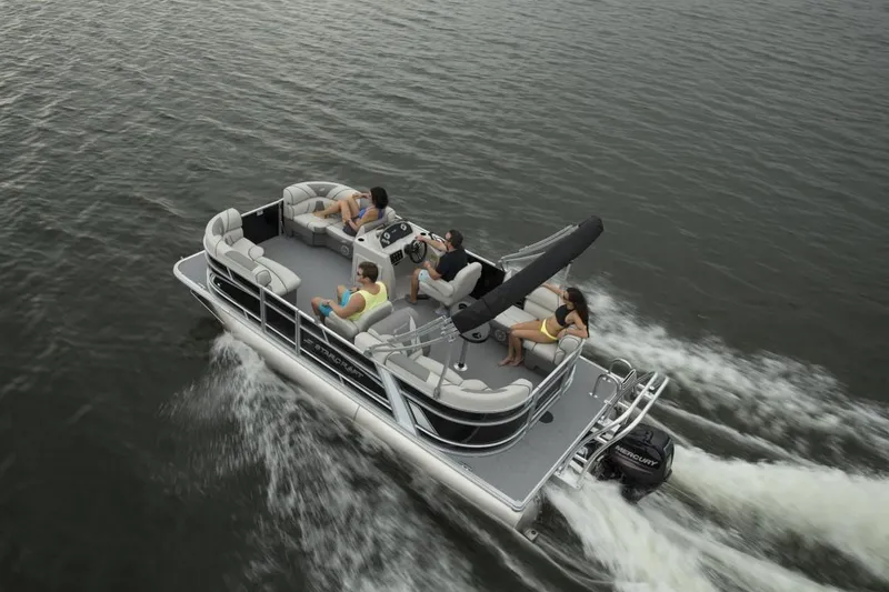 Slide: The Image of 2024 Starcraft EX 20 pontoon boat cruising on water with passengers. - 9
