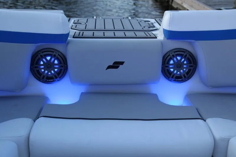 Slide: The Image of 2024 Starcraft 231 SVX boat interior with blue LED lighting and speakers. - 12