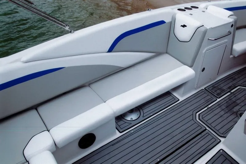Slide: The Image of 2024 Starcraft 231 SVX boat interior with white and blue seating. - 18