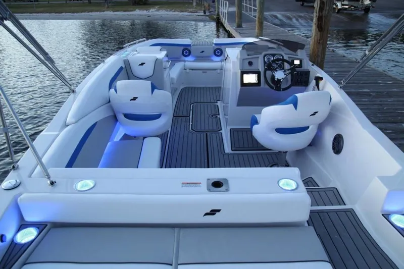 Slide: The Image of 2024 Starcraft 231 SVX boat interior with modern seating and blue LED lighting. - 7