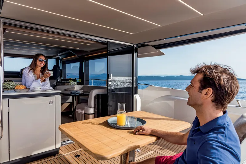 Slide: The Image of Couple enjoying breakfast on the 2024 Absolute 58 Navetta yacht. - 14