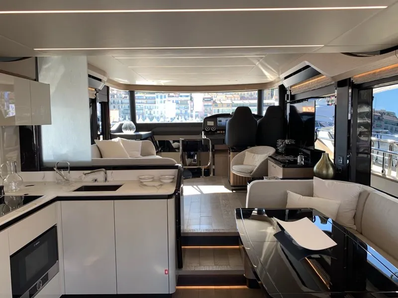 Slide: The Image of Luxurious interior of the 2024 Absolute 58 Navetta yacht with modern kitchen and seating area. - 17