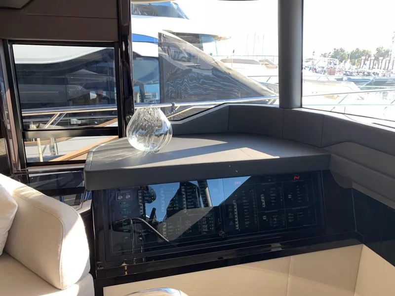 Slide: The Image of Interior view of 2024 Absolute 58 Navetta yacht with control panel and glass vase. - 20