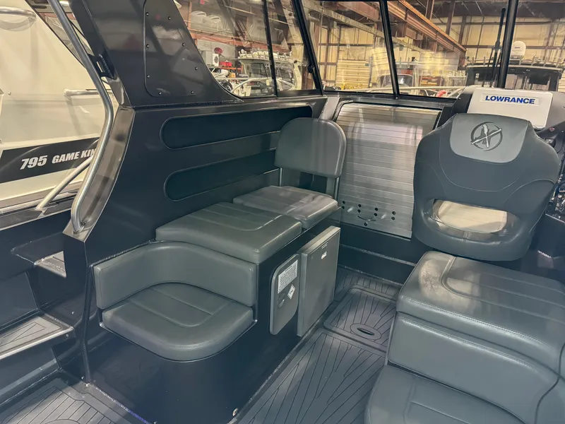 Slide: The Image of curved seating on the 2020 Extreme Boats 795 Walk Around - 6