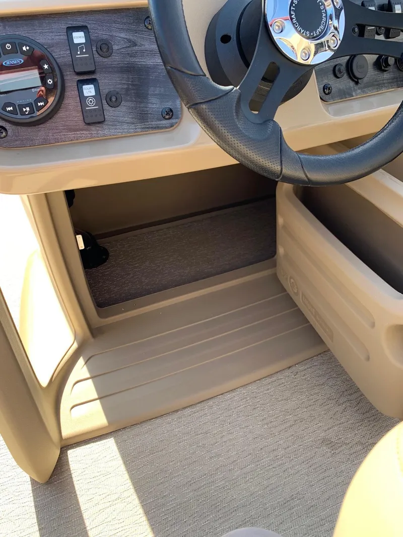 Slide: The Image of 2024 Starcraft LX20R boat dashboard and steering wheel close-up. - 9