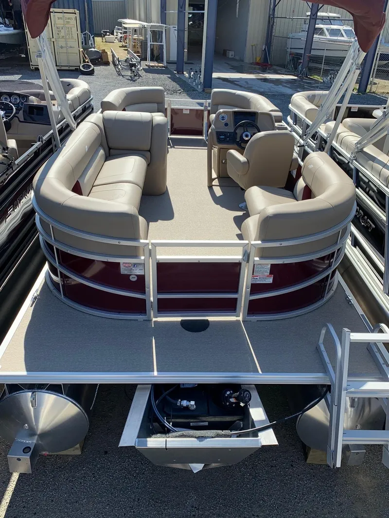 Slide: The Image of 2024 Starcraft LX20R pontoon boat with beige seating and modern helm. - 3