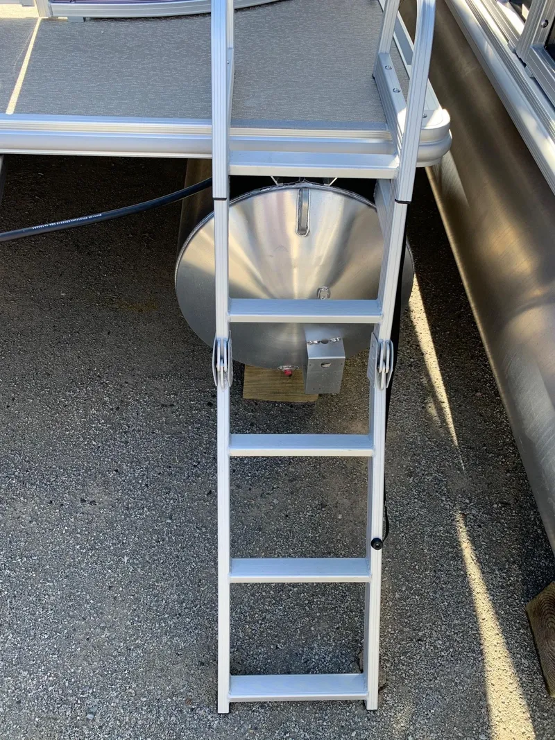 Slide: The Image of 2024 Starcraft LX20R boat ladder and rear platform. - 4