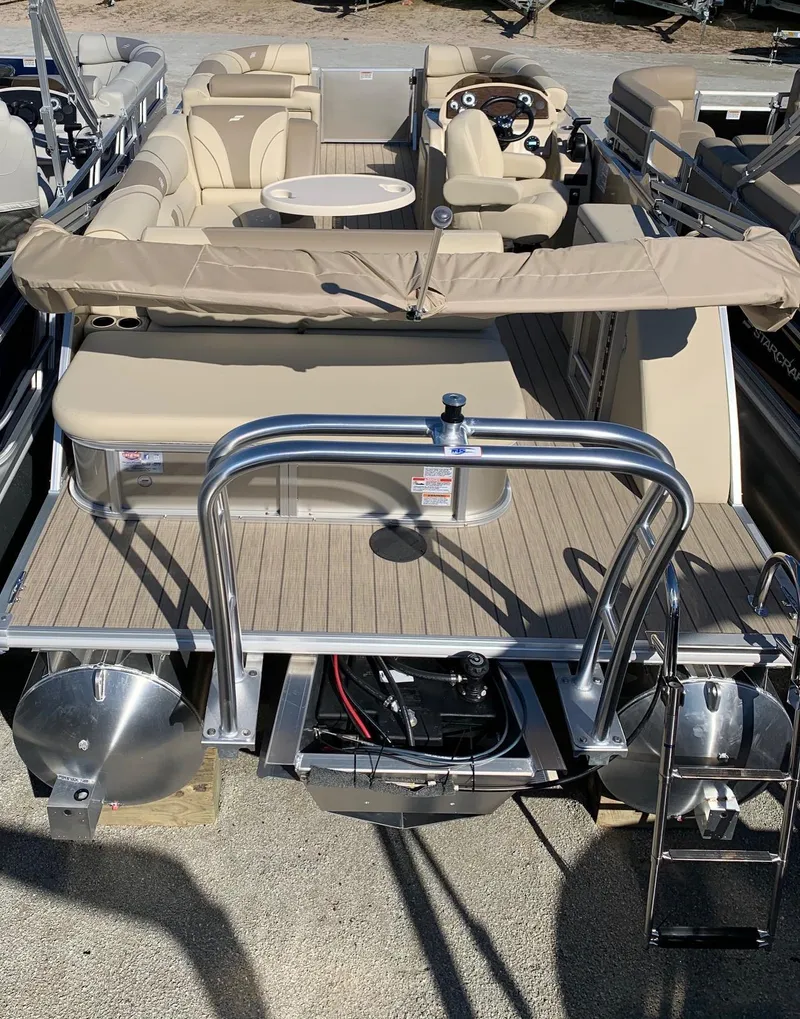 Slide: The Image of 2024 Starcraft EX22Q pontoon boat with beige seating and canopy. - 3