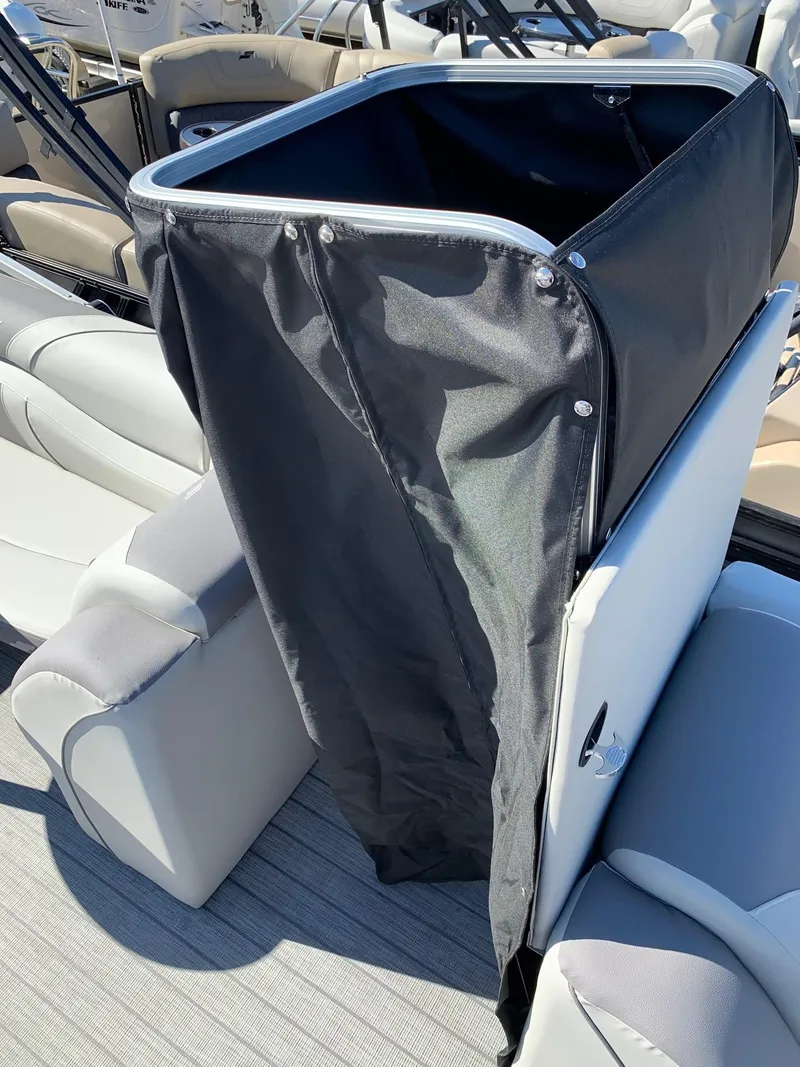 Slide: The Image of 2024 Starcraft EX22Q boat interior with black privacy curtain. - 10