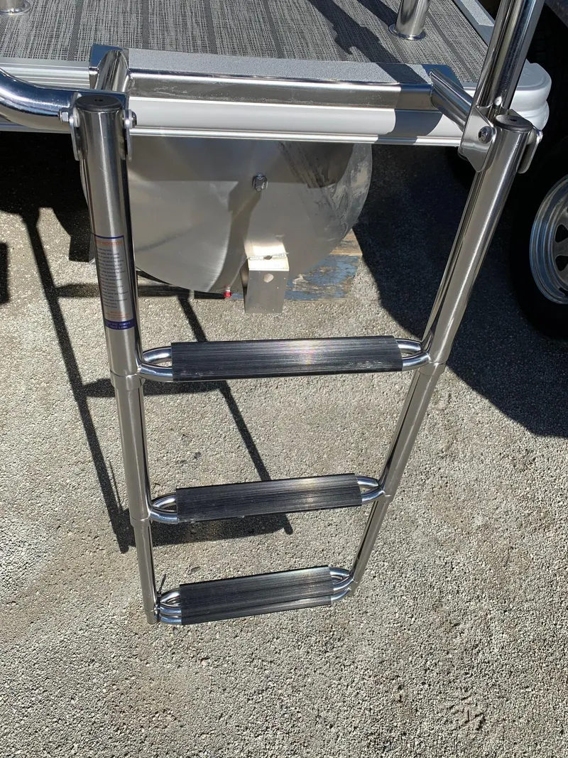 Slide: The Image of 2024 Starcraft EX22Q boat ladder with three steps. - 3