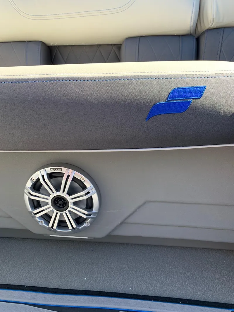 Slide: The Image of 2024 Starcraft SLS3 boat interior with speaker and blue logo. - 7