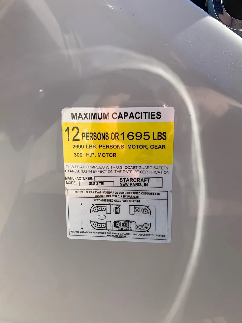Slide: The Image of 2024 Starcraft SLS3 boat capacity label showing maximum capacity of 12 persons or 1695 lbs. - 15